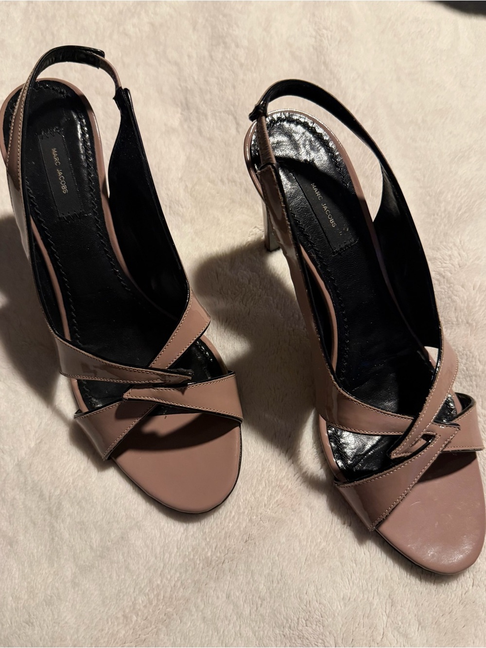 Vintage Marc Jacobs slingback heels feature a glossy, nude-taupe patent leather